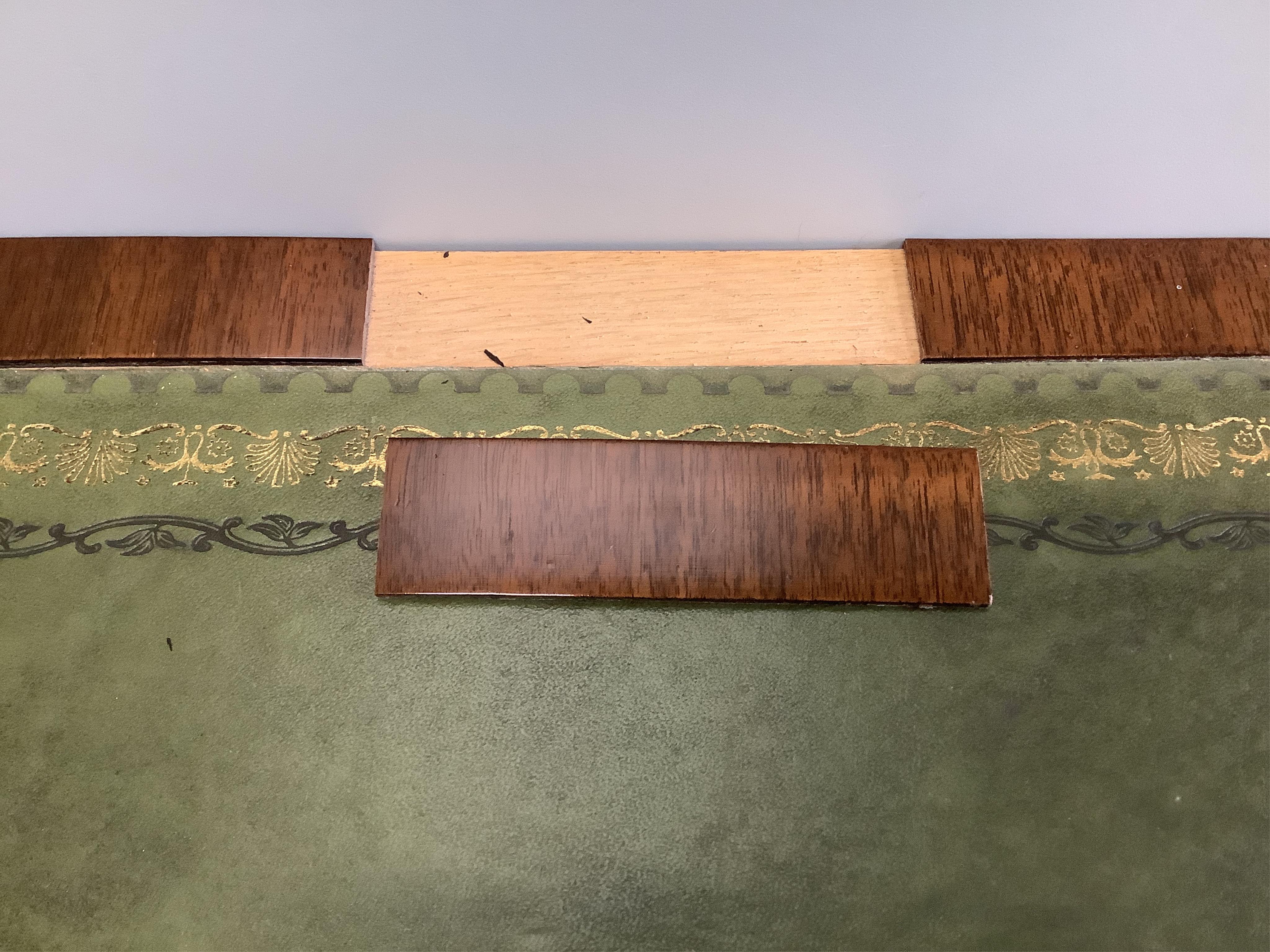 A late Victorian mahogany three drawer writing table, with an inset leather top, width 113cm, depth 55cm, height 77cm. Condition - fair to good, one piece of veneer detached but present